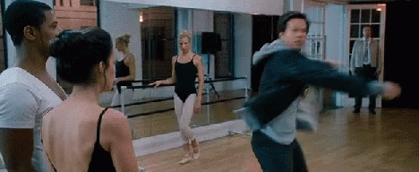 A Group Of People Are Standing In A Dance Studio . GIF