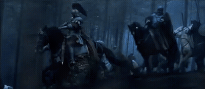 A Group Of People Are Standing In A Dark Forest With The Words Hold The Line GIF