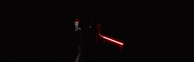 A Group Of People Are Standing In A Dark Room Holding Red Lightsabers . GIF