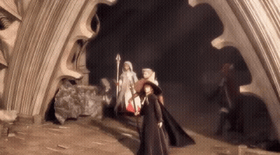 A Group Of People Are Standing In A Dark Room Holding Swords GIF