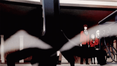 A Group Of People Are Standing In A Dark Room With A Black Object In The Middle GIF