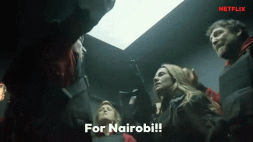 A Group Of People Are Standing In A Dark Room With The Words For Nairobi Written On The Bottom GIF