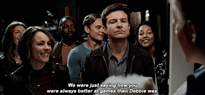 A Group Of People Are Standing In A Line And One Of Them Is Talking To Another Person . GIF
