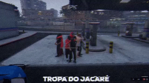 A Group Of People Are Standing In A Parking Lot And The Words Tropa Do Jacare Are On The Screen GIF