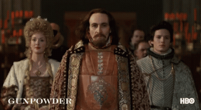 A Group Of People Are Standing In A Room And The Word Gunpowder Is On The Bottom GIF