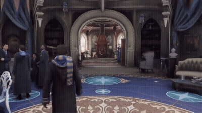 A Group Of People Are Standing In A Room With A Blue Floor GIF