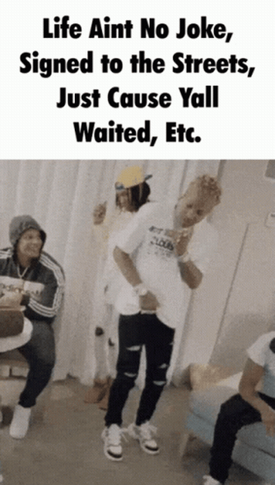 A Group Of People Are Standing In A Room With A Caption That Says Life Aint No Joke GIF