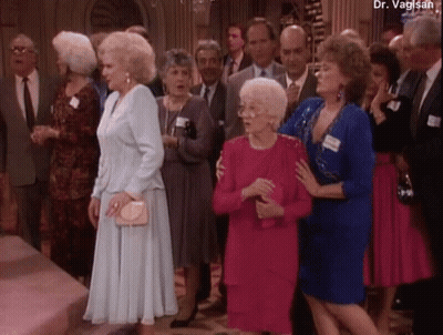 A Group Of People Are Standing In A Room With The Name Dr. Vaglish At The Top GIF
