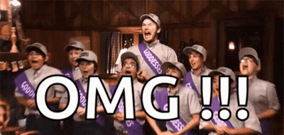 A Group Of People Are Standing In A Room With The Word Omg Written On The Bottom GIF
