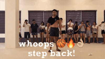 A Group Of People Are Standing In A Room With The Words Whoops Step Back GIF