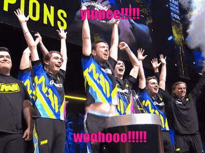 A Group Of People Are Standing In Front Of A Sign That Says Champions GIF