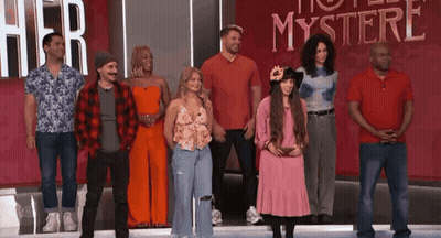 A Group Of People Are Standing In Front Of A Sign That Says " Her Mystery " GIF