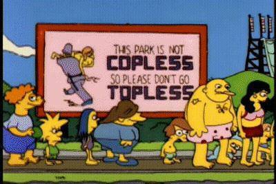A Group Of People Are Standing In Front Of A Sign That Says This Park Is Not Copless So Please Don T Go Topless GIF