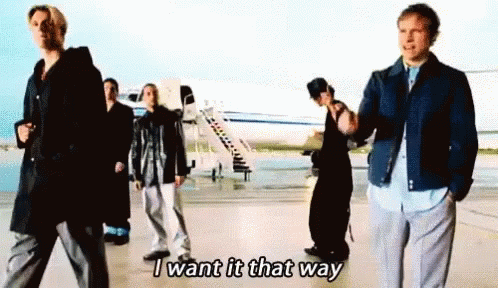 A Group Of People Are Standing In Front Of An Airplane And One Of Them Is Saying I Want It That Way GIF