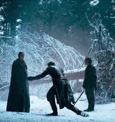 A Group Of People Are Standing In The Snow Holding Swords GIF