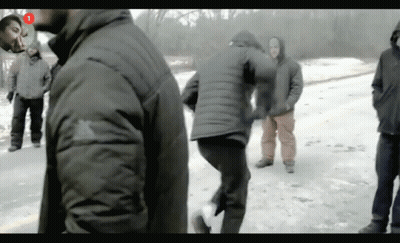 A Group Of People Are Standing In The Snow With The Number 1 In The Corner GIF