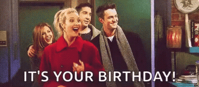 A Group Of People Are Standing Next To Each Other And Laughing While A Woman Says `` It 'S Your Birthday '' . GIF