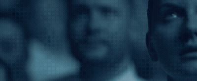 A Group Of People Are Standing Next To Each Other And Looking Up At Something . GIF