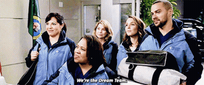 A Group Of People Are Standing Next To Each Other And One Of Them Is Holding A Bag And Saying We 'Re The Dream Team GIF