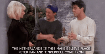 A Group Of People Are Standing Next To Each Other And Talking About Peter Pan And Tinkerbell . GIF