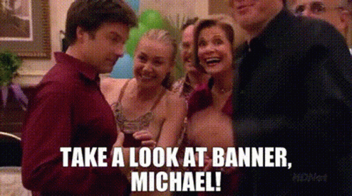 A Group Of People Are Standing Next To Each Other At A Party And One Of Them Is Holding A Glass Of Wine . GIF