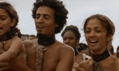 A Group Of People Are Standing Next To Each Other In A Crowd Without Shirts On . GIF