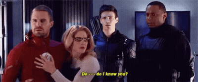 A Group Of People Are Standing Next To Each Other In A Room And A Woman Is Holding A Man 'S Hand . GIF