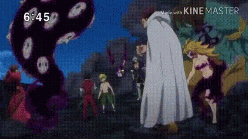 A Group Of People Are Standing Next To Each Other In Front Of A Large Monster . GIF