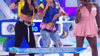 A Group Of People Are Standing Next To Each Other On A Stage With Microphones . GIF