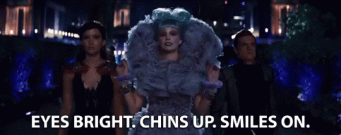 A Group Of People Are Standing Next To Each Other With The Words `` Eyes Bright , Chins Up , Smiles On '' . GIF