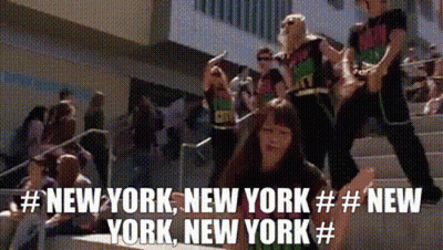 A Group Of People Are Standing On A Set Of Stairs With The Words New York New York New York GIF