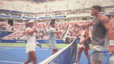 A Group Of People Are Standing On A Tennis Court With Rackets . GIF