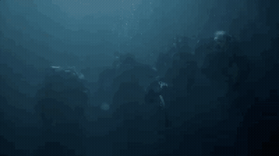 A Group Of People Are Swimming In The Ocean With Bubbles Coming Out Of The Water . GIF
