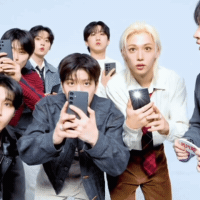 A Group Of People Are Taking A Picture Of Themselves With Their Phones GIF