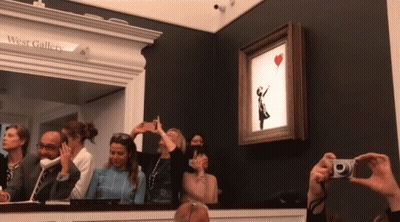 A Group Of People Are Taking Pictures Of A Painting At The West Gallery GIF