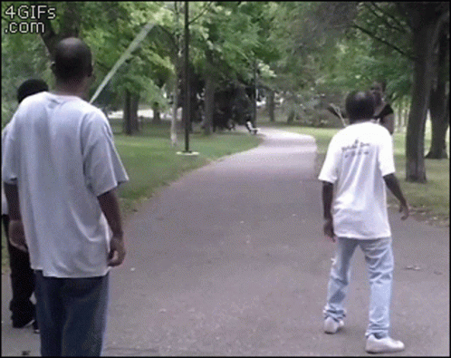 A Group Of People Are Walking Down A Path With A 4Gifs.com Watermark In The Corner GIF
