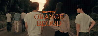 a group of people are walking down a road and the words orange blood are on the bottom