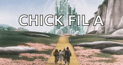 A Group Of People Are Walking Down A Yellow Brick Road With The Words Chick Fila Written On The Bottom GIF