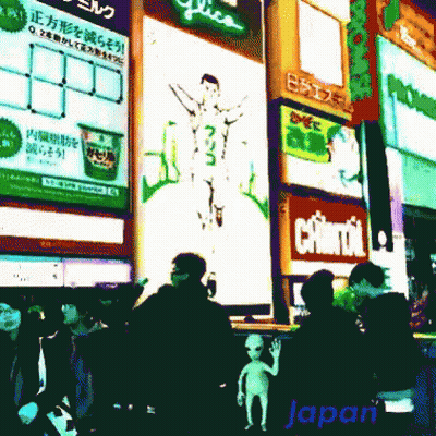 A Group Of People Are Walking In Front Of A Sign That Says Japan GIF