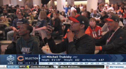A Group Of People Are Watching A Football Game With The Name Mitchell Trubisky On The Bottom GIF
