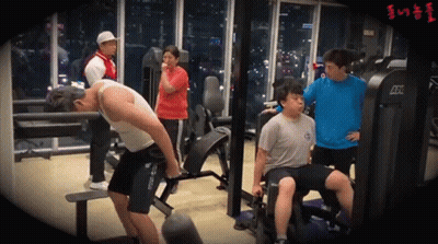 A Group Of People Are Working Out In A Gym With A Machine That Says Atx GIF