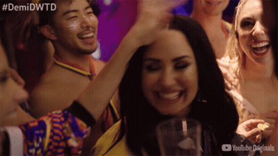 A Group Of People At A Party With The Hashtag #Demidwtd GIF