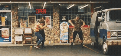 A Group Of People Dancing In Front Of A Pepsi Store GIF