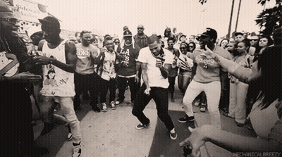 A Group Of People Dancing In Front Of A Sign That Says Mechanicalbreezezy GIF