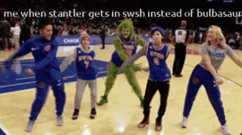 A Group Of People Dancing On A Basketball Court GIF