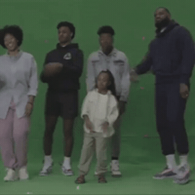 A Group Of People Dancing On A Green Screen GIF