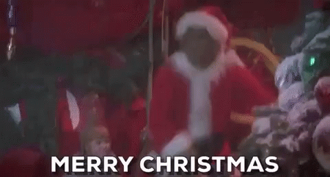 A Group Of People Dressed As Santa Claus Are Standing Next To A Christmas Tree And Saying Merry Christmas . GIF