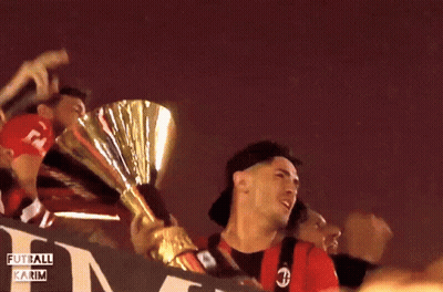 A Group Of People Holding A Trophy With The Words Fut All Karim Written On The Bottom GIF
