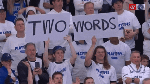 A Group Of People Holding Up A Sign That Says " Two Words " GIF