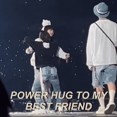 A Group Of People Hugging Each Other On A Stage With The Words `` Power Hug To My Best Friend '' Written Above Them . GIF